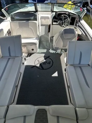 Slide: The Image of 2023 MasterCraft X24 boat interior with modern seating and dashboard design. - 16