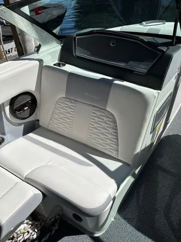 Slide: The Image of 2023 MasterCraft X24 boat interior with white seating and modern design. - 9