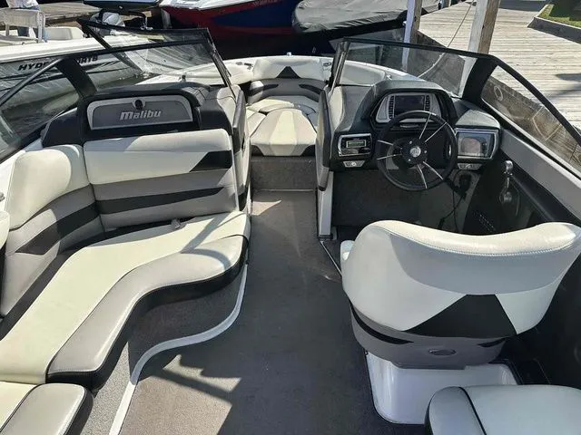 Slide: The Image of 2014 Malibu Wakesetter 23 LSV interior with sleek seating and modern dashboard design. - 3