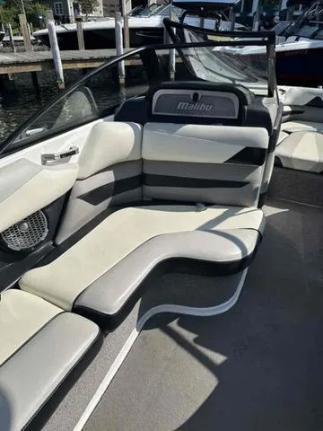 Slide: The Image of 2014 Malibu Wakesetter 23 LSV boat interior with sleek seating and modern design. - 4