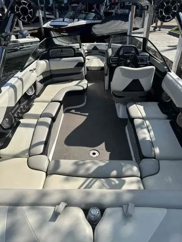 Slide: The Image of 2014 Malibu Wakesetter 23 LSV interior with spacious seating and modern design. - 8