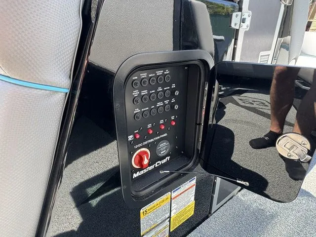 Slide: The Image of Control panel of a 2018 MasterCraft X23 boat, featuring switches and labels. - 20