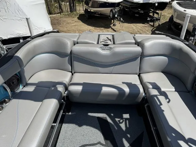 Slide: The Image of 2018 MasterCraft X23 boat interior with gray seating and modern design. - 8