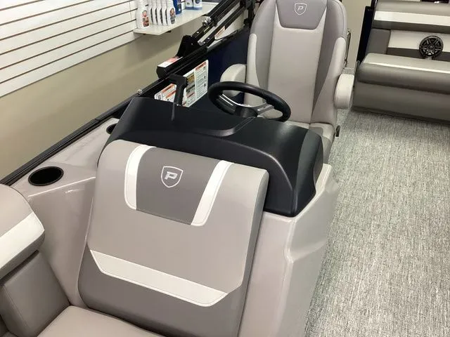 Slide: The Image of 2025 Premier 200 SUNSCAPE RE-CL boat interior with modern seating and steering console. - 12