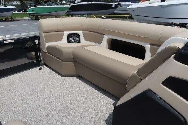 Slide: The Image of 2024 Premier 230 Solaris RF boat interior with beige seating and modern design. - 13