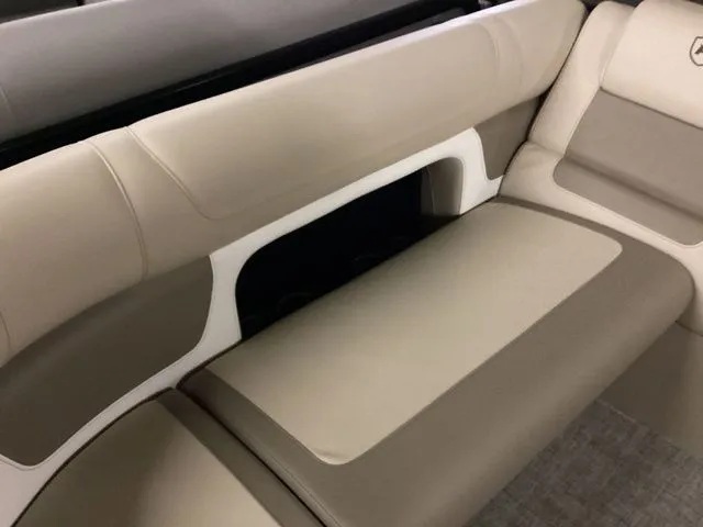 Slide: The Image of 2024 Premier 230 Solaris RF boat interior with beige seating and modern design. - 18