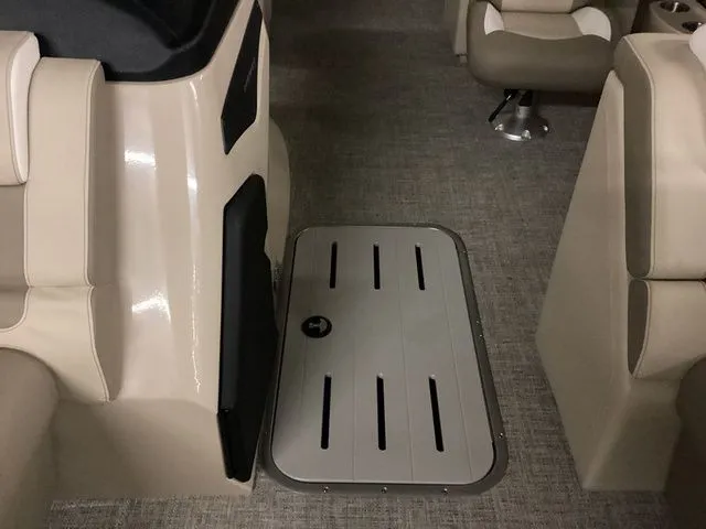 Slide: The Image of 2024 Premier 230 Solaris RF interior with beige seating and gray flooring. - 20