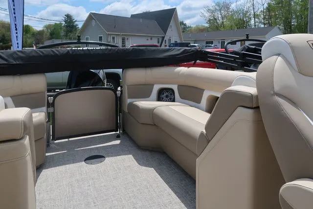 Slide: The Image of 2024 Premier 230 Solaris RF boat interior with beige seating and modern design. - 7