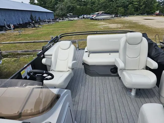 Slide: The Image of 2025 Sylvan Mirage 8520 CLZ DH pontoon boat with white seating and spacious deck. - 6
