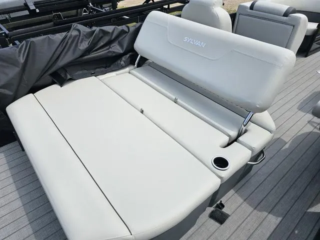 Slide: The Image of 2025 Sylvan Mirage 8520 CLZ DH boat with comfortable seating and cup holder. - 9