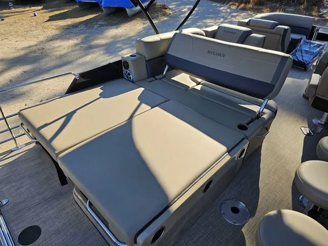 Slide: The Image of 2025 Sylvan MIRAGE X3 DLZ BAR pontoon boat with spacious seating and modern design. - 17