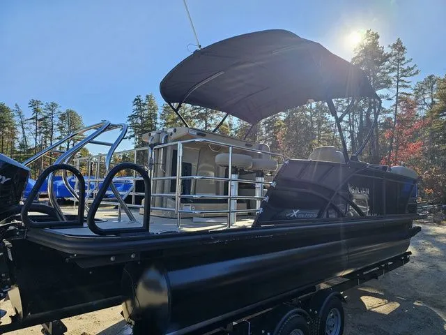 Slide: The Image of 2025 Sylvan MIRAGE X3 DLZ BAR pontoon boat with canopy in a sunny outdoor setting. - 4