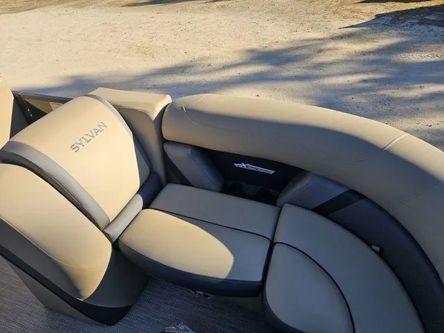 Slide: The Image of 2025 Sylvan MIRAGE X3 DLZ BAR boat seating with beige upholstery. - 7