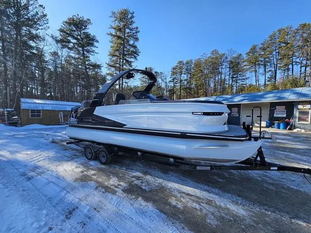 Slide: The Image of 2025 Sylvan M3 CLZ DC boat on trailer in snowy outdoor setting. - 1