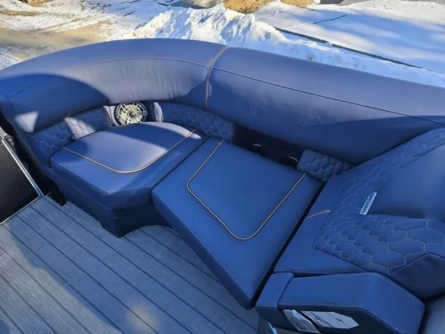 Slide: The Image of Luxurious blue seating on 2025 Sylvan M3 CLZ DC boat, featuring modern design and comfort. - 10