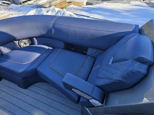 Slide: The Image of Luxurious blue seating on 2025 Sylvan M3 CLZ DC boat, featuring quilted design and armrest. - 11