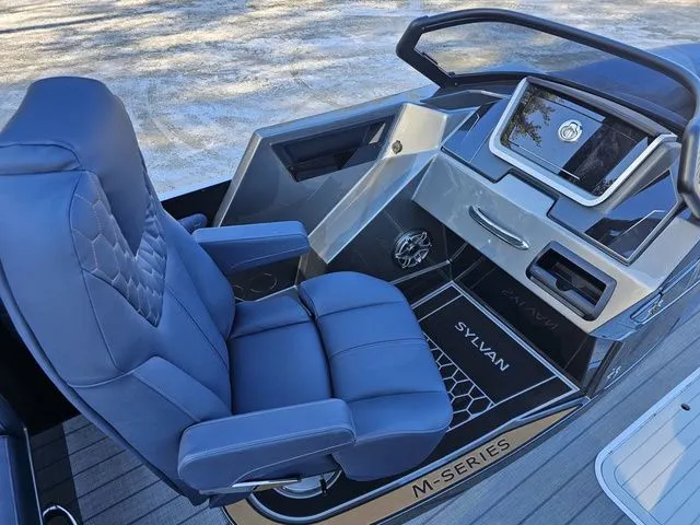 Slide: The Image of Luxurious 2025 Sylvan M3 CLZ DC boat interior with plush seating and modern dashboard. - 16