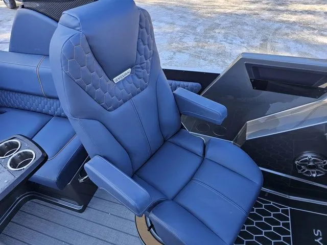 Slide: The Image of Luxurious blue seating in 2025 Sylvan M3 CLZ DC boat, featuring cup holders and modern design. - 17