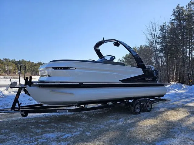Slide: The Image of 2025 Sylvan M3 CLZ DC boat on trailer in snowy landscape. - 2