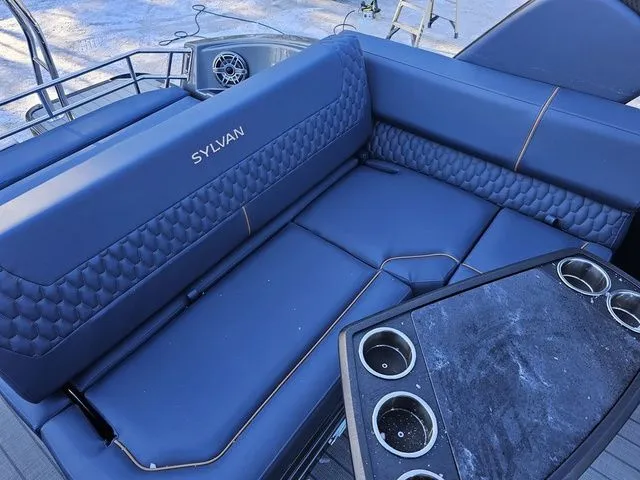 Slide: The Image of Luxurious seating on 2025 Sylvan M3 CLZ DC boat with cup holders and stylish design. - 20