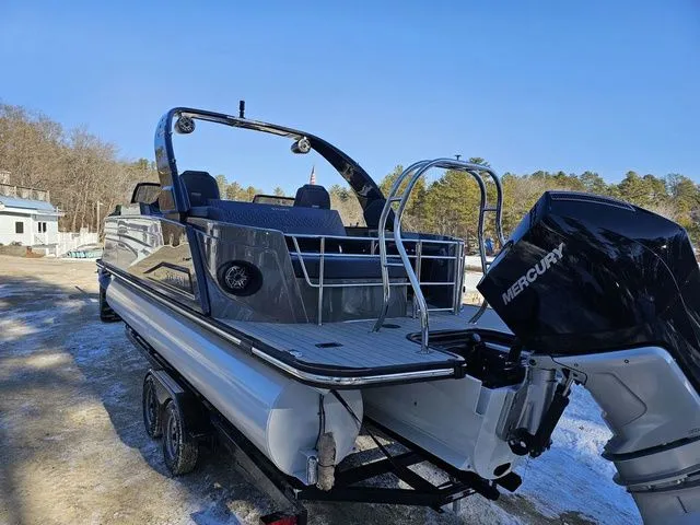 Slide: The Image of 2025 Sylvan M3 CLZ DC pontoon boat with Mercury engine on trailer. - 27