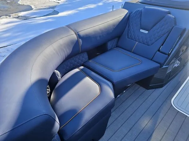 Slide: The Image of Luxurious seating on 2025 Sylvan M3 CLZ DC boat, featuring elegant blue upholstery. - 7