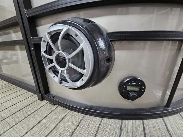 Slide: The Image of Speaker and control panel on 2025 Sylvan Mirage X1 boat interior. - 3