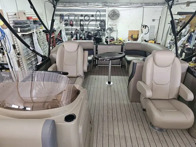 Slide: The Image of 2025 Sylvan Mirage X1 boat interior with luxurious seating and modern design. - 7