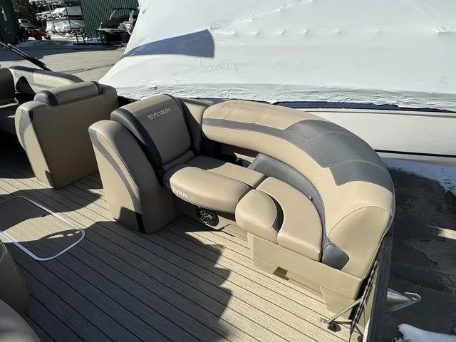 Slide: The Image of 2023 Sylvan L-3 DLZ BAR pontoon boat with beige and gray seating. - 6