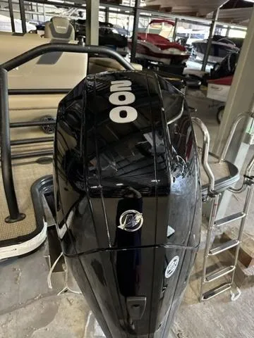 Slide: The Image of 2023 Sylvan L-3 DLZ boat with a powerful 200 HP outboard motor in a marina. - 3