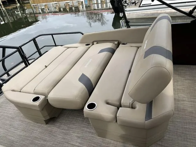 Slide: The Image of 2023 Sylvan L-3 DLZ boat with beige seating and cup holders on deck. - 3
