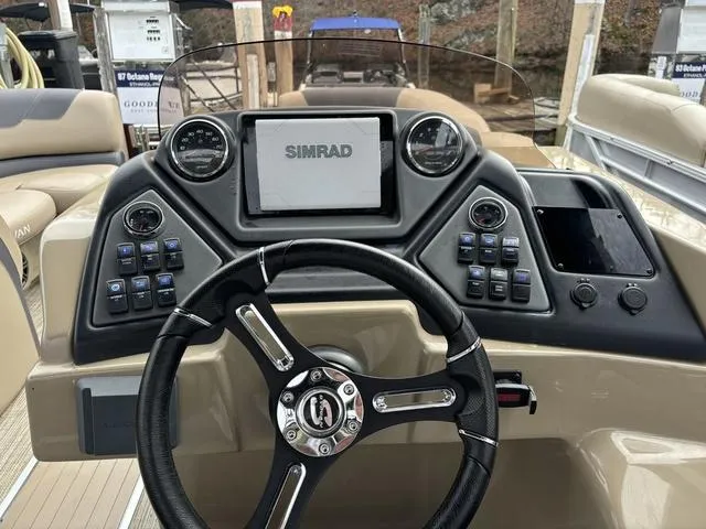 Slide: The Image of Steering console of 2023 Sylvan L-3 DLZ boat with Simrad display and controls. - 4