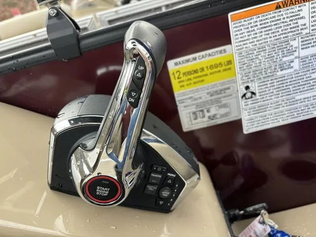 Slide: The Image of Throttle control of 2023 Sylvan L-3 DLZ boat with capacity warning labels. - 5