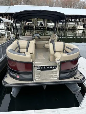 Slide: The Image of 2023 Sylvan L-3 DLZ pontoon boat docked at marina. - 6