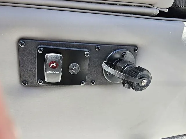 Slide: The Image of Control panel on 2023 Sylvan S3 LZ boat with washdown switch and adjustable knob. - 10
