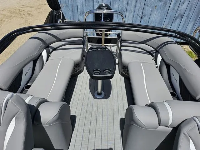 Slide: The Image of 2023 Sylvan S3 LZ boat interior with gray seating and central table. - 12