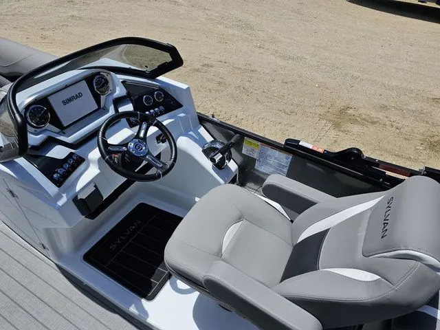 Slide: The Image of 2023 Sylvan S3 LZ boat cockpit with steering wheel and control panel. - 13
