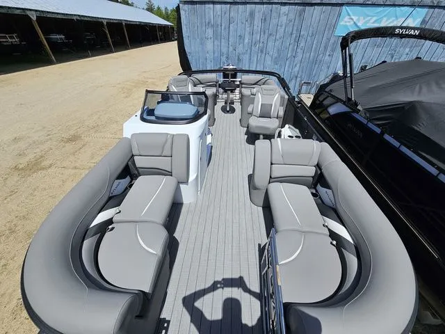 Slide: The Image of 2023 Sylvan S3 LZ pontoon boat with spacious seating and modern design. - 6