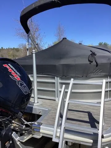 Slide: The Image of 2022 Bennington 24 LSRC pontoon boat with Mercury Pro XS engine and covered deck. - 20