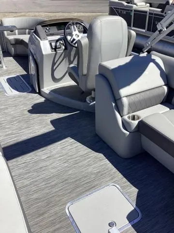 Slide: The Image of 2022 Bennington 24 LSRC boat interior with modern seating and steering console. - 5