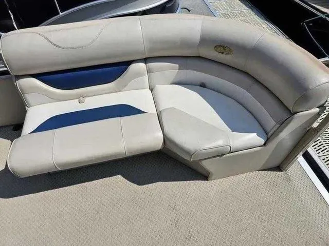Slide: The Image of 2006 Sylvan Mirage 8520 boat seating with beige and blue upholstery. - 8