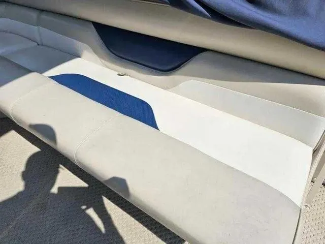 Slide: The Image of 2006 Sylvan Mirage 8520 boat seating with blue and white upholstery. - 9