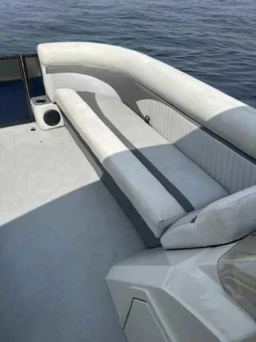 Slide: The Image of 2017 Crest 250 SL boat with spacious seating on calm water. - 11