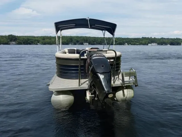 Slide: The Image of Pontoon boat on lake, 2017 Crest 250 SL, with canopy and outboard motor. - 3