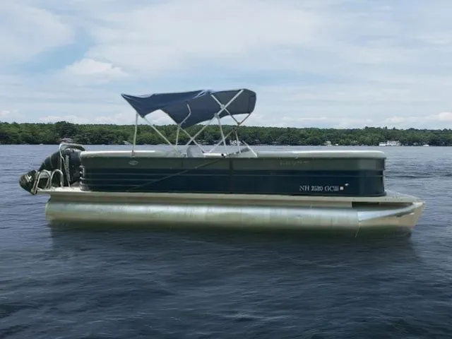 Slide: The Image of 2017 Crest 250 SL pontoon boat on a lake with a canopy. - 4