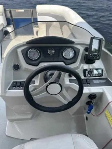 Slide: The Image of 2017 Crest 250 SL boat dashboard with steering wheel and navigation controls. - 6