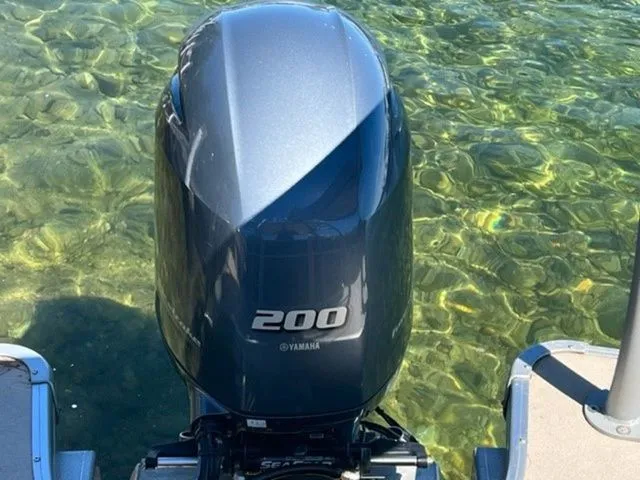 Slide: The Image of Yamaha 200 outboard motor on 2019 Godfrey Pontoons SWPE 255 WB TT-25 in clear water. - 4