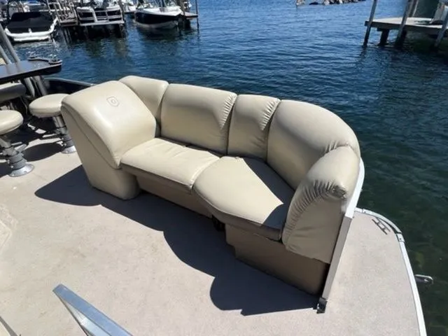 Slide: The Image of 2019 Godfrey Pontoons SWPE 255 WB TT-25 with beige seating on a lake. - 5