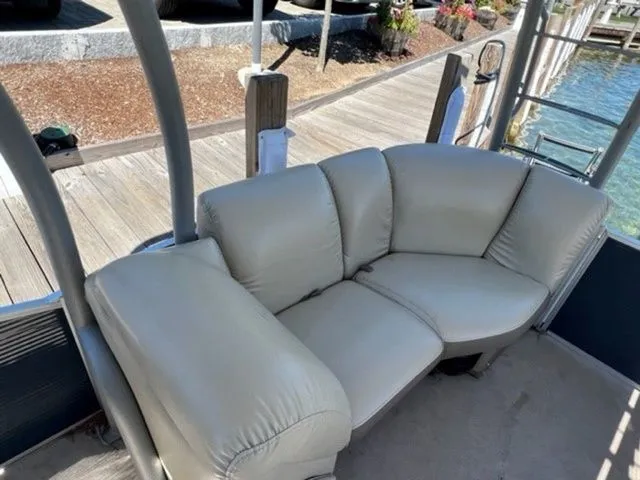 Slide: The Image of 2019 Godfrey Pontoons SWPE 255 WB TT-25 with beige seating on a docked boat. - 6