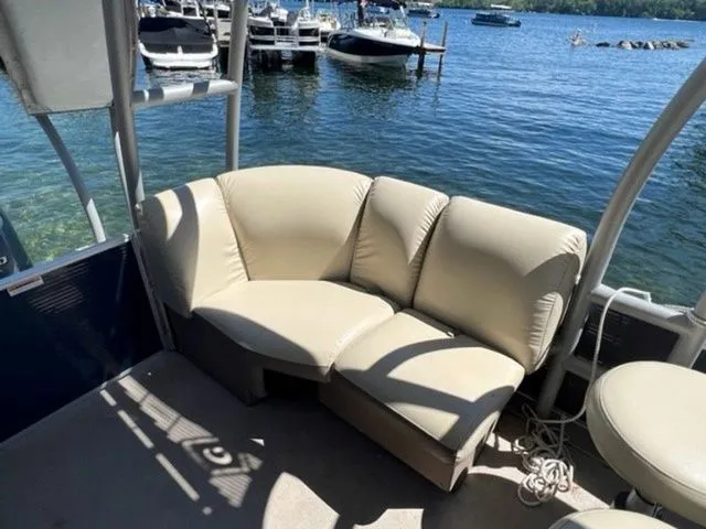 Slide: The Image of 2019 Godfrey Pontoons SWPE 255 WB TT-25 with beige seating, docked by a lake. - 7